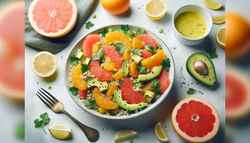 A vibrant citrus quinoa salad with grapefruit, orange, avocado, cilantro, and lemon dressing on a clean table.