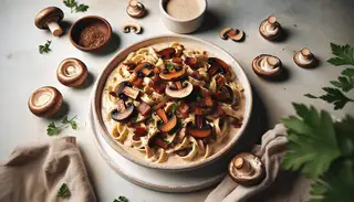 A minimalist vegan creamy mushroom carbonara with handmade pasta, cashew sauce, tempeh bacon, shiitake, and parsley, beautifully lit and ready to serve.