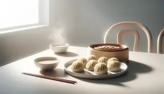 Fresh vegan dim sum on a white plate, steam rising, with dipping sauce on a minimalist wooden table, well-lit setting.