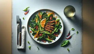 Crispy, golden seitan with citrus-infused Asian greens, sprinkled with chili and orange zest, garnished with sesame seeds, alongside a glass of herbal tea on a simple table.