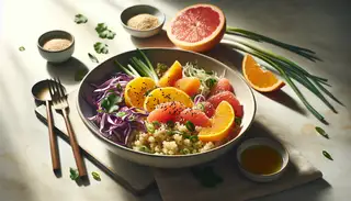 Vibrant Asian vegan lunch in a bowl with quinoa, orange, grapefruit, purple cabbage, carrots, green onions, cilantro, sesame seeds, and a glossy dressing, illuminated by natural light.