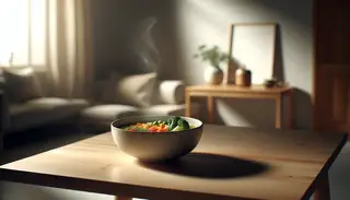 Zen dining setting with colorful vegan vegetable soup on minimalist wooden table, exuding warmth and tranquility