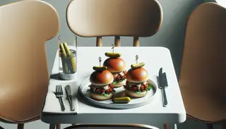 Realistic image of a minimalist table setting featuring smoky BBQ chickpea sliders on a small plate, with fresh garnishes and no clutter.