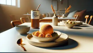 Artfully presented Umami Miso Caramel Ice Cream on a clean, minimalistic table setting, inviting indulgence.