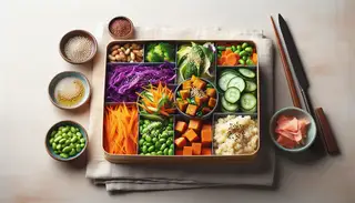Image of a minimalist bento box filled with African-Asian fusion cuisine, featuring sorghum, purple cabbage, carrots, cucumber, edamame, sweet potato, pickled ginger, and sesame seeds.