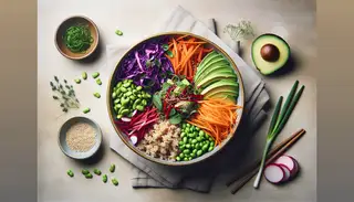 Minimalist table setting featuring a vibrant vegan Asian bowl with brown rice, colorful vegetables, edamame, avocado, dressing, and garnishes, emphasizing fresh, plant-based eating.