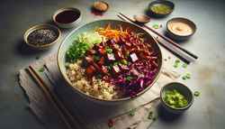 Smoky Vegan Asian BBQ Bowl with brown rice, caramelized jackfruit, purple cabbage, green onions, sesame seeds, chili flakes, and wasabi mayo on a minimalist table.