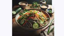 Image of a Vegan Soba Noodle Salad on a clean, minimalist table, featuring colorful vegetables and sesame seed garnish in a serene setting.