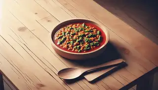 A vibrant bitter marinade in a dish on a wooden table, ready to be enjoyed.